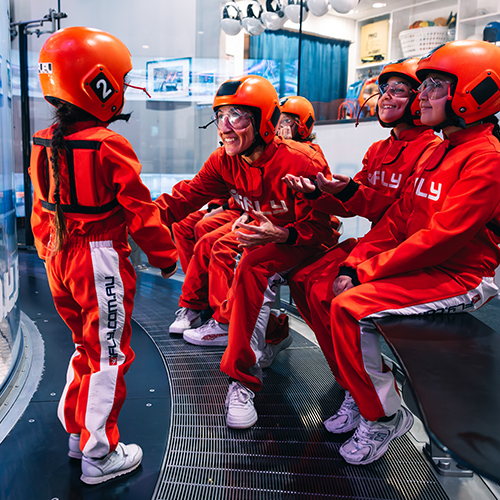 Family sharing their indoor skydiving experience